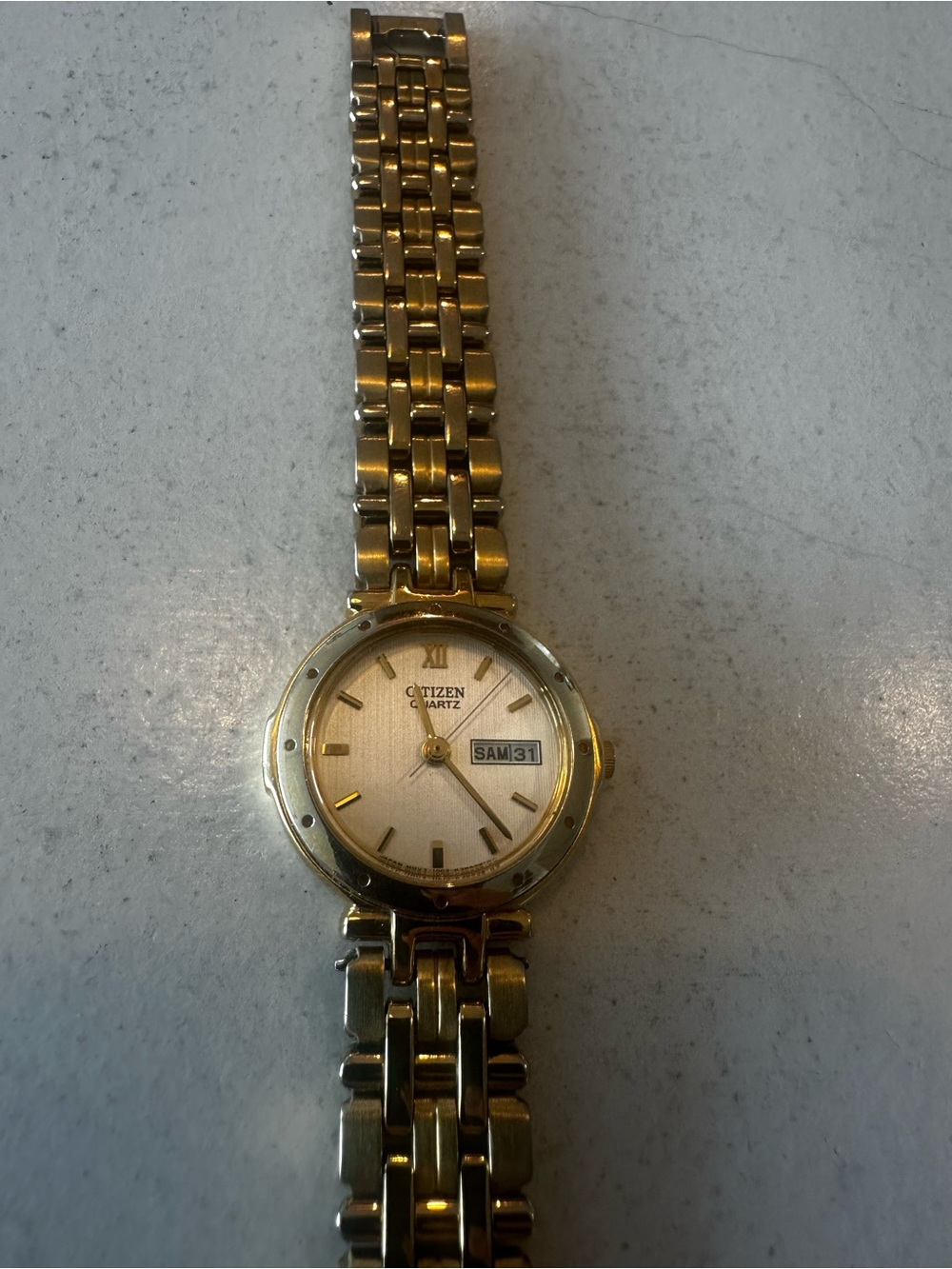 Gently used Citizen Gold-Tone Women's Quartz Watch with Day-Date Adjust